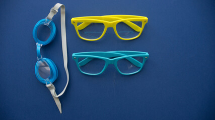 colored glasses on a blue background