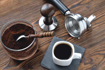 coffee in a cup on a stone stand, glass jar with coffee and a vintage coffee spoon, coffee...
