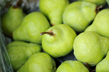 Blurry photo of Fresh green pears texture and background