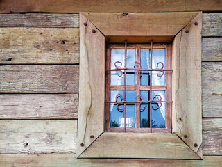 old window in a wooden house in the village