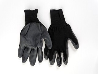 gloves in an assortment of construction gloves for a garden and a vegetable garden on a white background