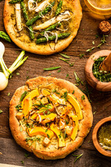 Homemade Small Vegetarian Pizza on Wooden Rustic Table. Top Down View