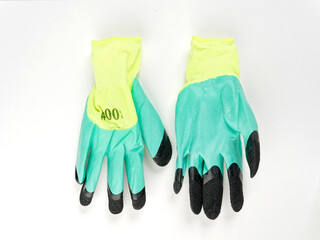 gloves in an assortment of construction gloves for a garden and a vegetable garden on a white background