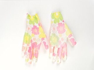 gloves in an assortment of construction gloves for a garden and a vegetable garden on a white background