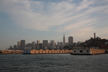 Fototapeta na wymiar View of San Francisco skyline from Alcatraz Island under sunset in San Francisco, California, USA.