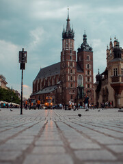 Obraz premium Old city square with church on a cloudy day