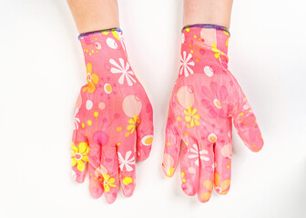 gloves in an assortment of construction gloves for a garden and a vegetable garden on a white background