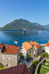 Top view of the houses and streets of the old coastal town of Perast, located in the Bay of Kotor,...