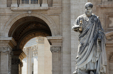 The statue of Saint Peter in the Vatican created by Giuseppe De Fabris, a pupil of Canova on the baroque background of the Basilica.