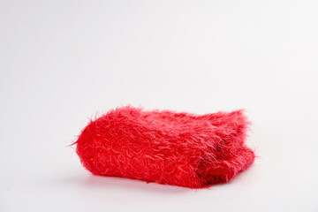 Red fluffy plush cloth isolated on white background. 
