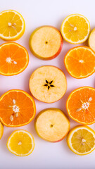 Apple and orange slices on a white background