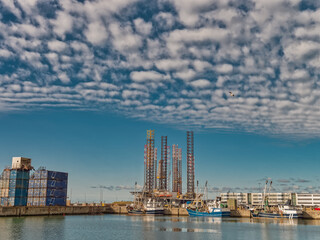 Fototapeta na wymiar Wind power rigs in Esbjerg harbor. Denmark