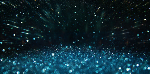 background of abstract glitter lights. silver, blue and black. de focused
