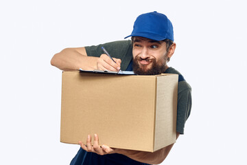 Working male courier with box in hand documents delivery service light background