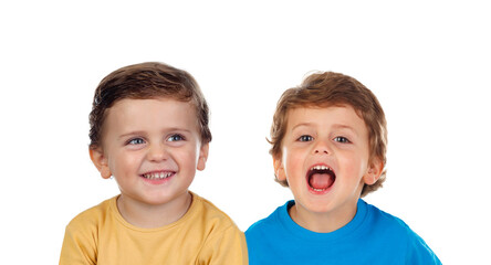 Funny child shouting and his twin brother laughing