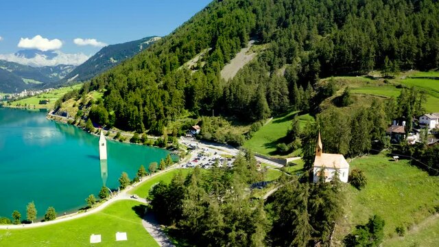 St. Anna Chapel and Submerged Bell Tower of Curon at Graun im Vinschgau on Lake Reschen in South Tyrol, Italy