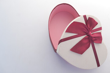 top view of open heart shape gift box on white background 