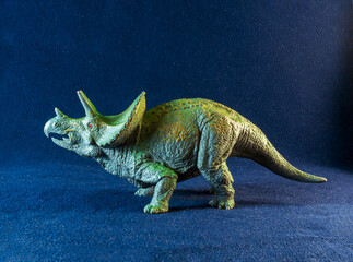 A model of triceratops the dark background. © vadim