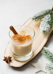 Obraz na płótnie Canvas Eggnog cocktail, creamy christmas drink with spice cinnnamon