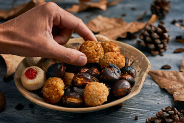 taking a panellet, typical confection of Catalonia