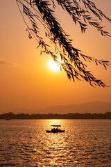 sunset on the Summer Palace lake in Beijing, China