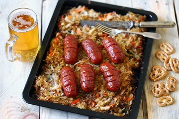 Oktoberfest menu. Baked sauerkraut with sausages. Beer and pretzels. Celebration of Oktoberfest.