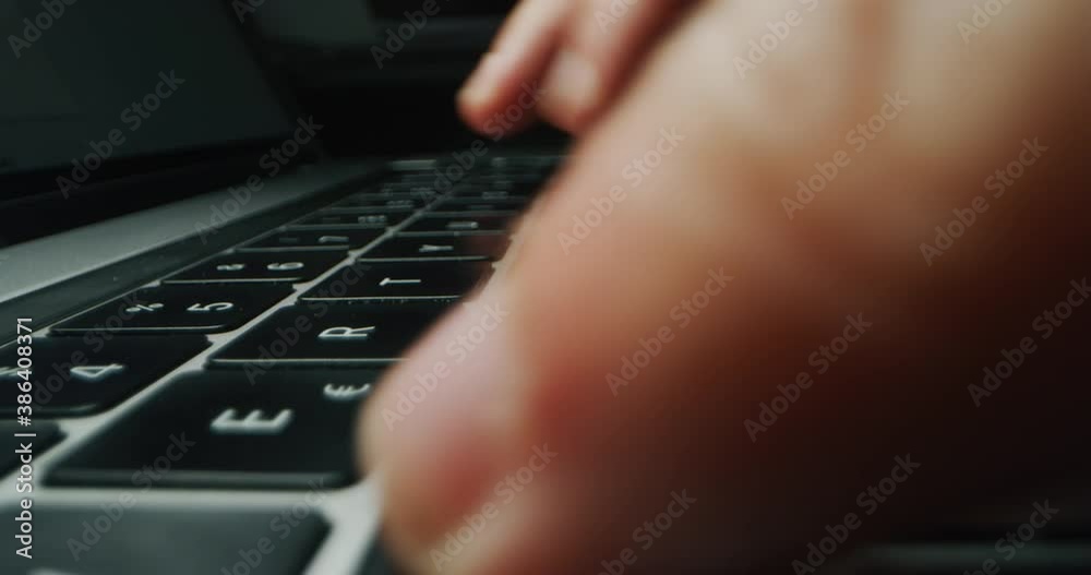 Wall mural alternative macro close up of an young businessman hands busy working on laptop or computer keyboard
