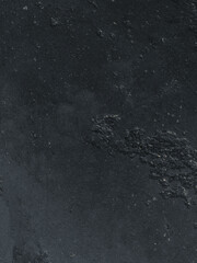 Black cement wall. Close-up. Background texture