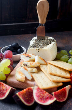 Traditional Greek cheese for greel halloumi on wooden board with vegatebles