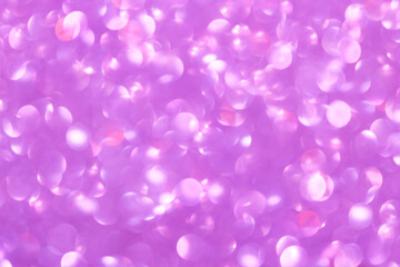 An abstract pink background with sparkle lights and bokeh. Pink blurred light.