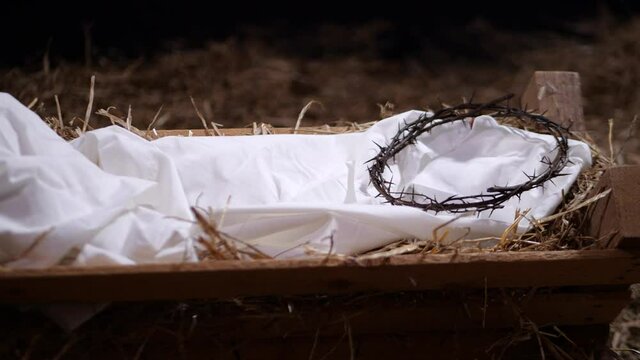 4K Dolly: Crown of Thorns laying in a Manger with straw and Hay. Christmas / Easter Scene for the Nativity 