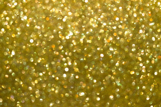 An Abstract Gold Background With Sparkle Lights And Bokeh. Gold Blurred Light.