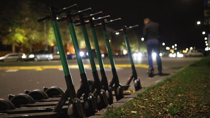 Man rents electric scooter and rides away at night © dissx