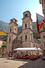Obraz premium View of the church with two bell towers in the old square