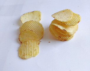 Potato Chips Wafers, close up with clipping path, Potato slices turning into chips isolated, Crispy potato, salted, masala (wafers), With Cream and onion, Coriander, Tomato Chips, namkeen