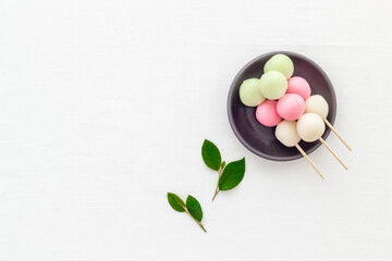 Naklejka na ściany i meble Japanese Dango dessert in pink, white and green colors, copy space
