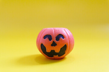 Halloween pumpkins on the yellow paper background. Halloween background. Space for text. copy space.