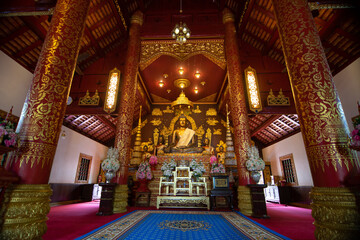 Golden Buddha statue at Wat Phra Kaew temple is public place and famous landmark tourist attraction in Chiangrai Thailand