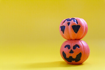 Halloween pumpkins on the yellow paper background. Halloween background. Space for text. copy space.