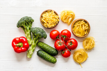 Grocery shopping set with vegetables and herbs, top view