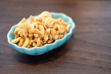 Crispy pork crackling in ceramic cup. Thai food