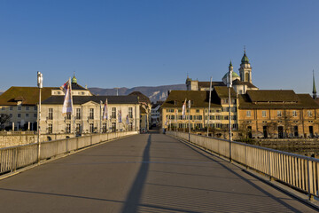 Riverside of Aare and houses dominated by Saint Ursus Cathedral in Solothurn, Switzerland