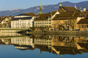 Riverside of Aare and houses dominated by Saint Ursus Cathedral in Solothurn, Switzerland
