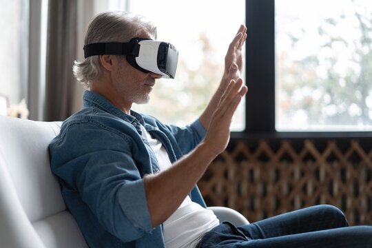 Handsome Man Trying Vr Glasses At Home