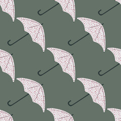 Diagonal season seamless pattern with umbrella silhouettes. Simple fall ornament in grey tones on green background.
