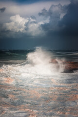 Sea storm with really big waves hitting the coast of Biarritz, at the Basque Country.
