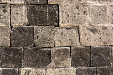 Grey old stone pavement background, part of stone masonry