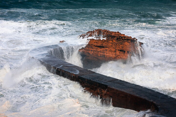 Sea storm with really big waves hitting the coast of Biarritz, at the Basque Country.