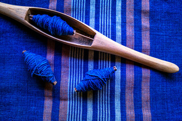 Woven cotton. Fabric cotton texture. Traditional Isan Thai Cotton indigo weaving. Shuttle weaving....