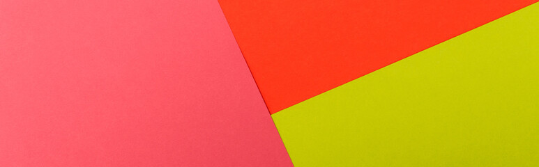 top view of colorful abstract red, green and pink paper background, panoramic shot